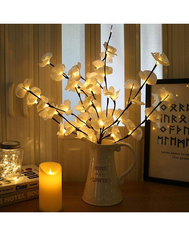Kezaro white orchid branch with soft LED lights, realistic floral detail, perfect for elegant home decor or floral arrangements.
