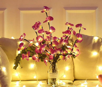 Kezaro white orchid branch with soft LED lights, decorative artificial orchid stem for home decor.